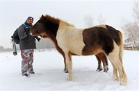 Fotograaf Unal met paarden